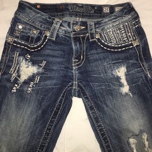 Dark denim, ripped/distressed, Miss Me jeans.